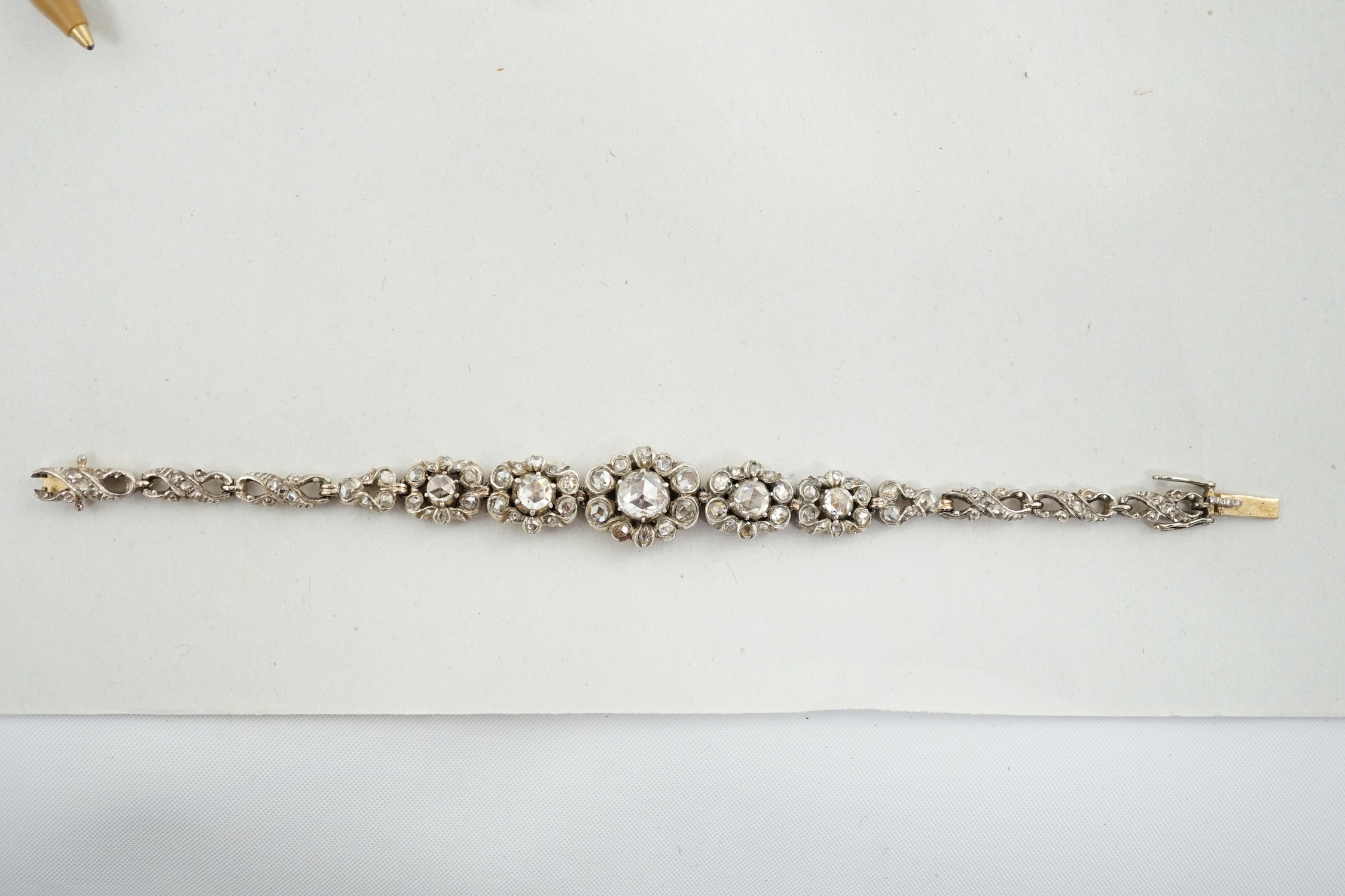 An early 20th century continental 14k gold and rose cut diamond cluster set bracelet